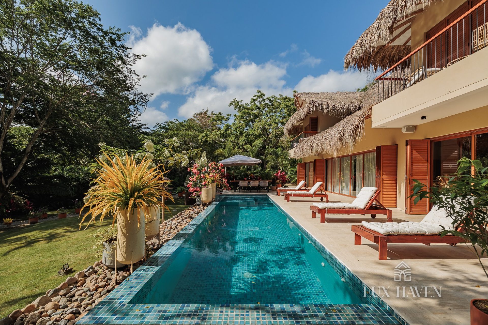 Private turquoise pool along the villa terrace