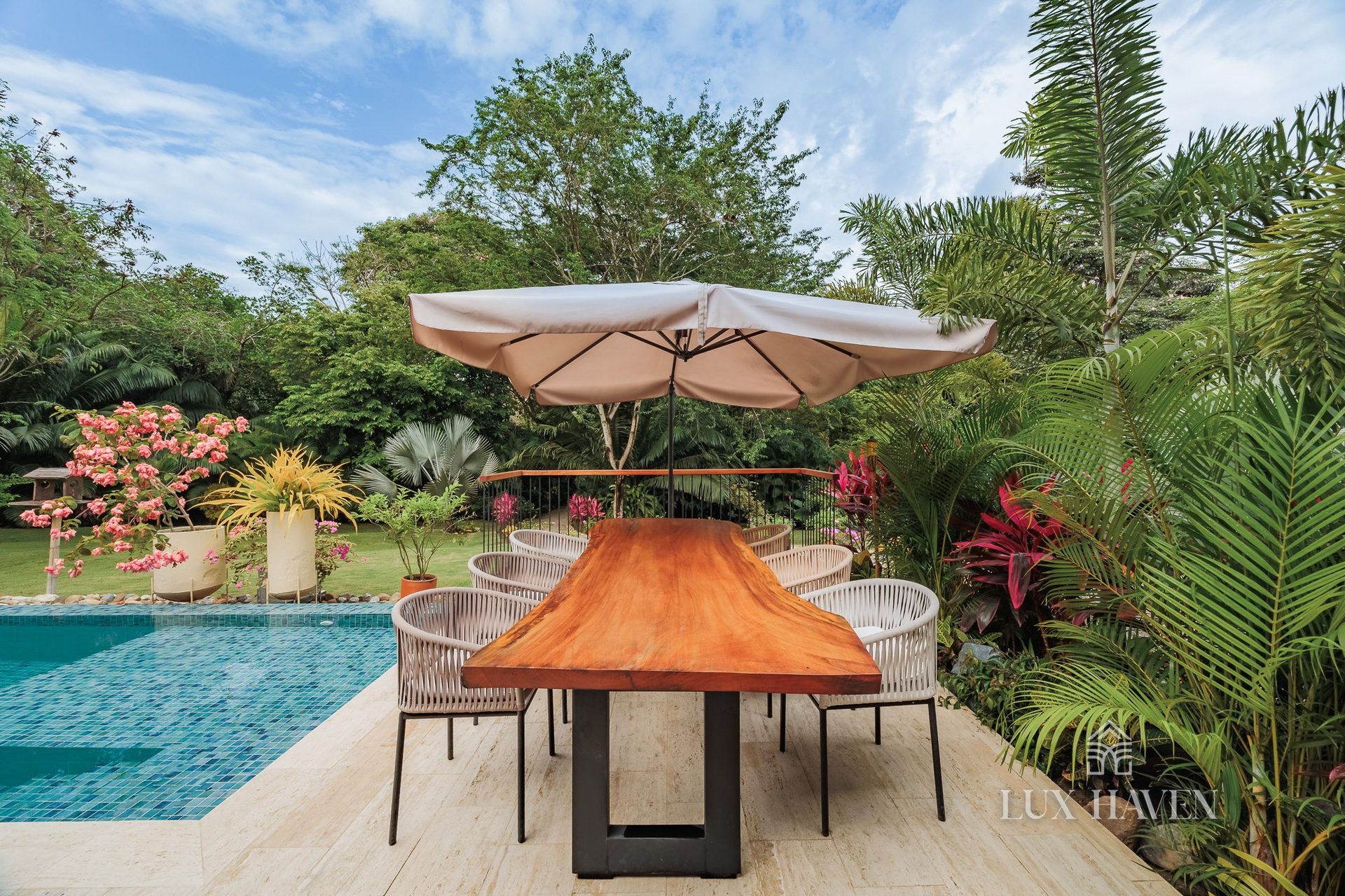 Alfresco dining table beside the pool