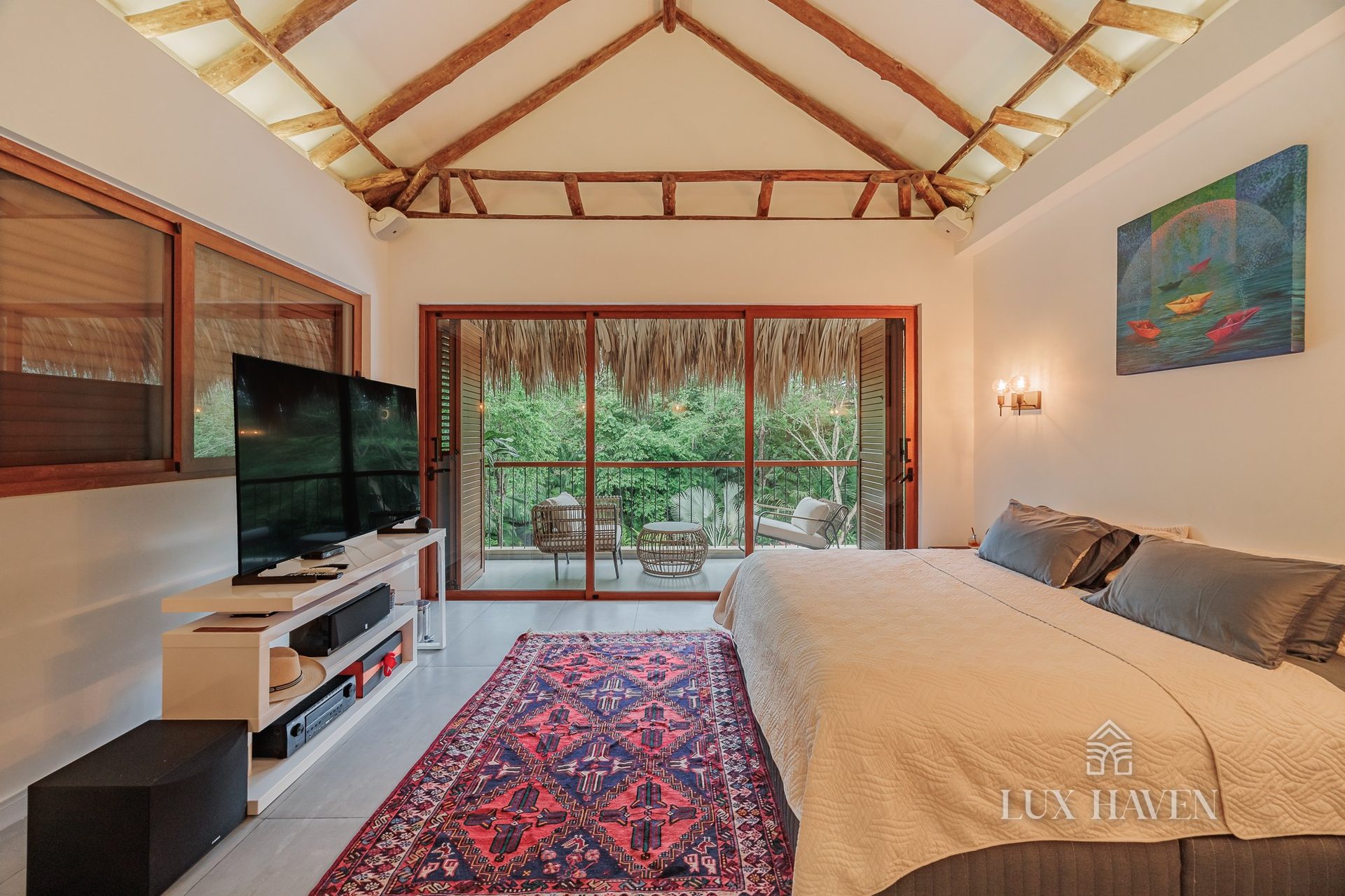 King suite with media lounge and artisan textiles