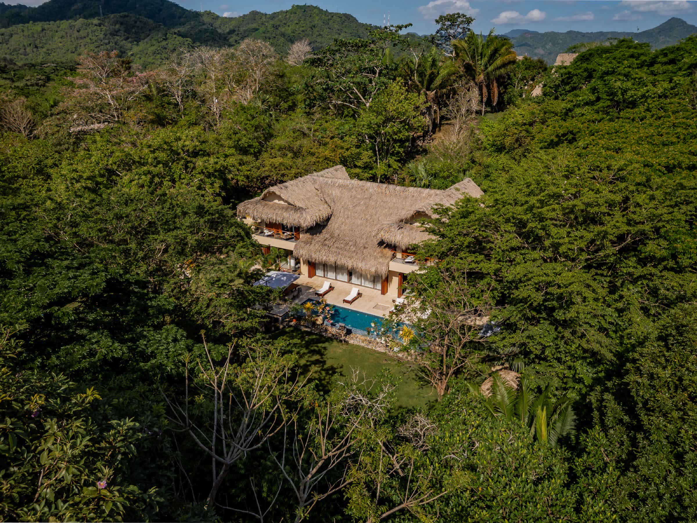 PURE Residential Retreat — private thatched-roof luxury villa rental hidden in the Palomino jungle, Colombia